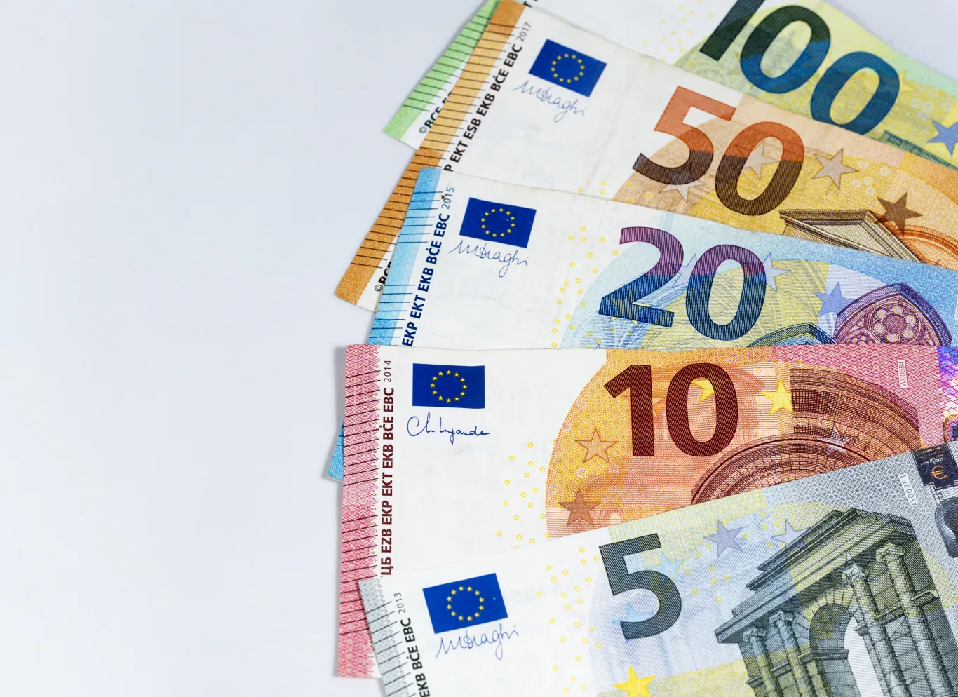 Euro banknotes in denominations of 5, 10, 20, 50 and 100 euros.